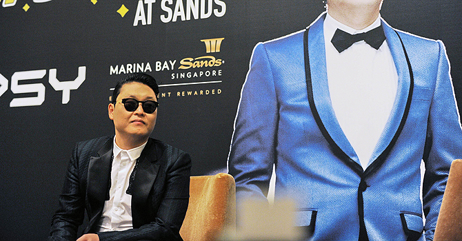 South Korean K-pop star Psy is seen at a press conference before performing in Singapore—AFP Photo