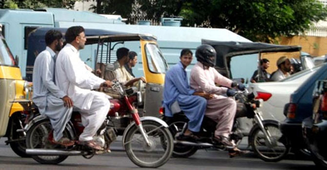 This file photo shows pillion riding in Pakistan. —File Photo