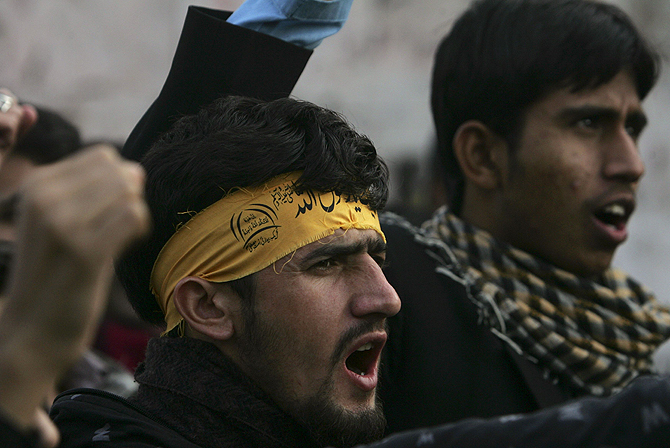 Supporters of the Imamia Students Organisation (ISO) and the Majlis-e-Wahdat-e-Muslimeen (MWM) religious group shout slogans during a protest against the bomb blasts a day earlier in Quetta, in Lahore January 11, 2013. – Photo by Reuters