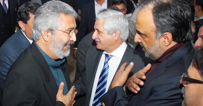 Saifuddin Khosa talks to Information Minister Qamar Zaman Kaira after announcing his decision to join Pakistan People's Party on Wednesday.  - Online