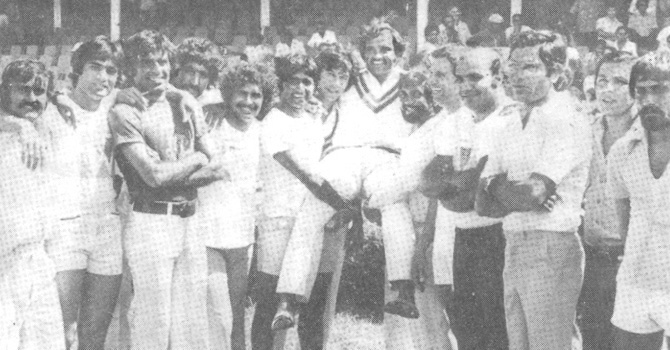 Mushtaq lifted on the shoulders by his team mates soon after Pakistan squared the series at the Port of Spain. (From Left): Iqbal Qasim, Mohsin Khan, Haroon Rashid, Sarfraz Nawaz, Wasim Bari, Javed Miandad, Imran Khan, Mushtaq Muhammad, Sadiq Muhammad, Asif Iqbal, Intikhab Alam, Zaheer Abbas, Saleem Altaf and Wasim Raja.