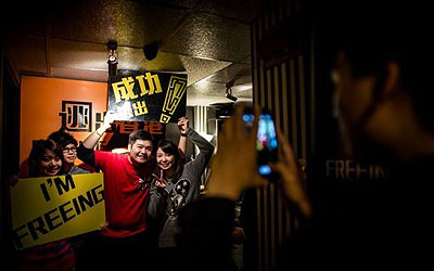 Participants pose for a photo after playing Freeing HK in Hong Kong. —Photo by AFP