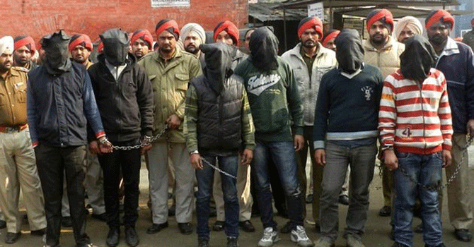 The accused presented before the court on rape and murder charges. — Photo by AFP