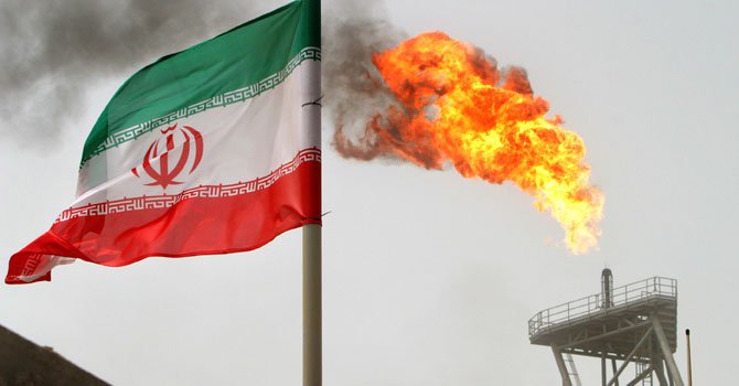 Iranian national flag flies at an Iranian oilfield. - File Photo