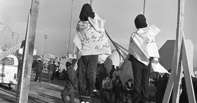 Two opponents of the Qaddafi regime hanged in public in 1977.