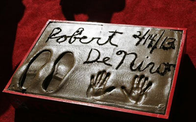 The hand and footprints of Robert De Niro are seen following the ceremony. —Photo by Reuters