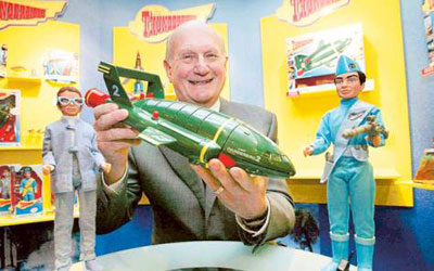 Creator Anderson poses with a toy Thunderbird 2 in 2005 on the 40th anniversary of the Thunderbirds first broadcast, in London. —Photo by AP