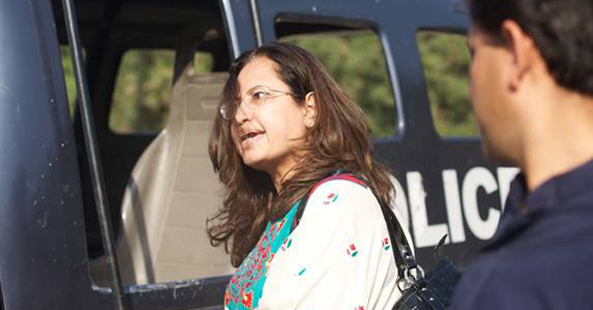 This brave lady was prepared to move the police mobile blocking the road by physical force. 