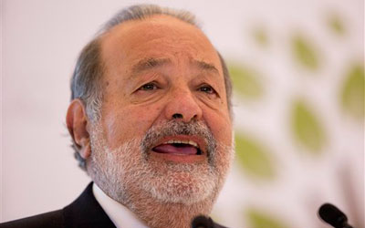 Mexican telecommunications tycoon Carlos Slim speaks during news conference early this year. —Photo by AP