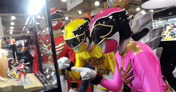 The Power Rangers check out their 20th anniversary collectibles at the American International Toy Fair. —Photo by AP