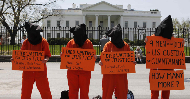 Activists rally in front of the White House demanding U.S. President Barack Obama to close down the U.S. prison in Guantanamo Bay while in Washington, April 11, 2013.       REUTERS/Larry Downing  (UNITED STATES - Tags: POLITICS CIVIL UNREST)