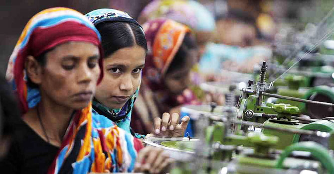 Workers manufacture clothing in a factory near Dhaka, Bangladesh. —AP (File) Photo