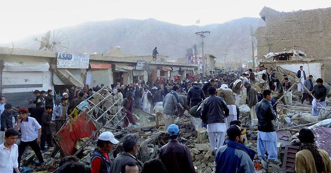 People gather after a bomb targeting Shias exploded in busy market in Quetta, on February 16, 2013. — Photo (File) AFP