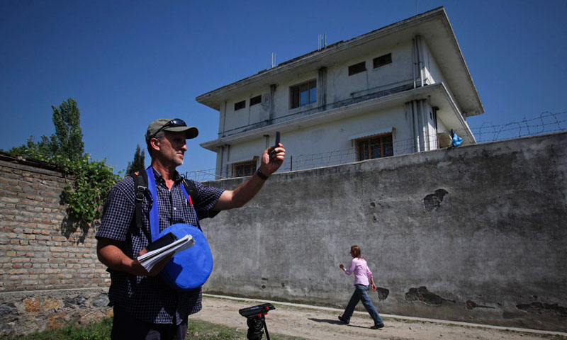 Journalists work outside the compound where Al Qaeda leader Osama bin Laden was killed in Abbottabad May 3, 2011. —Photo by Reuters