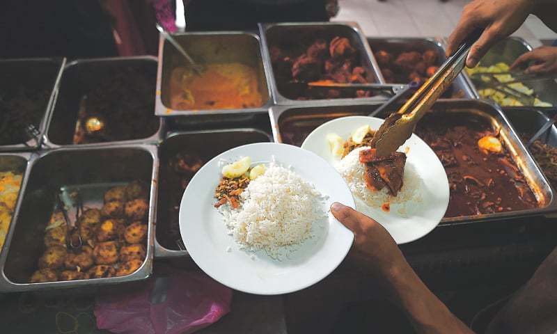 Spicing up Malaysia’s beloved ‘fatty rice’ - World - DAWN.COM
