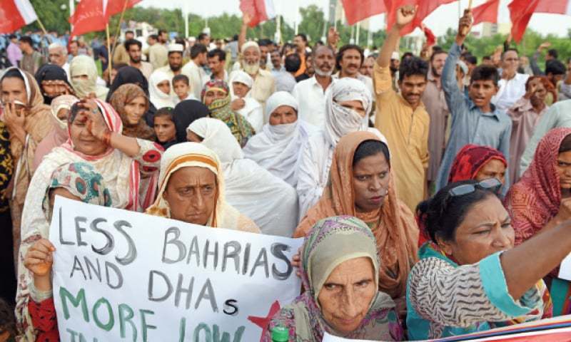 Slum-dwellers protest razing of homes - Newspaper - DAWN.COM