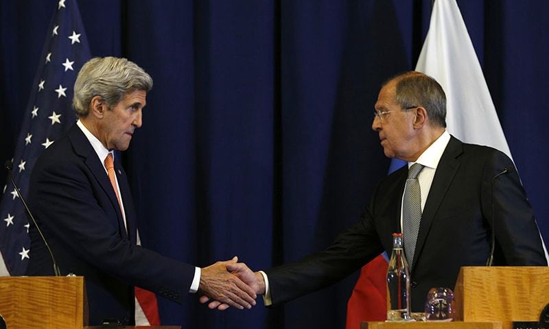 U.S. Secretary of State John Kerry, left, and Russian Foreign Minister Sergei Lavrov shakes hands at the conclusion of a joint press conference following their meeting to discuss the crisis in Syria, in Geneva, Switzerland, Friday.— AP