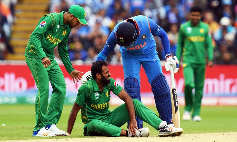 Yuvraj Singh consoles injured Wahab Riaz during the ICC Champions trophy match. —AFP/File