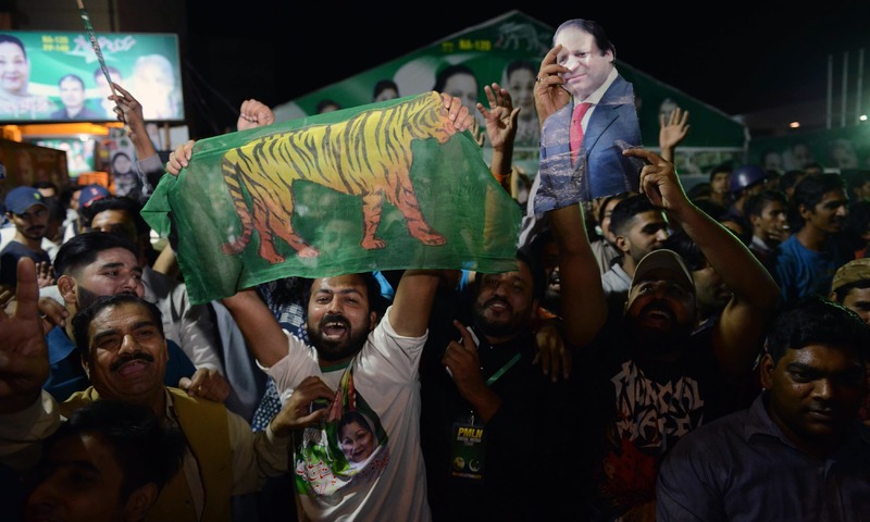 PML-N activists celebrate victory in the by-election in Lahore. —AFP