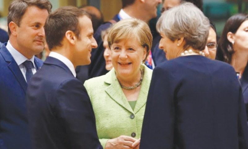 French President Emmanuel Macron, German Chancellor Angela Merkel and British PM Theresa May at the EU summit in Brussels, Belgium on June 22.— Reuters