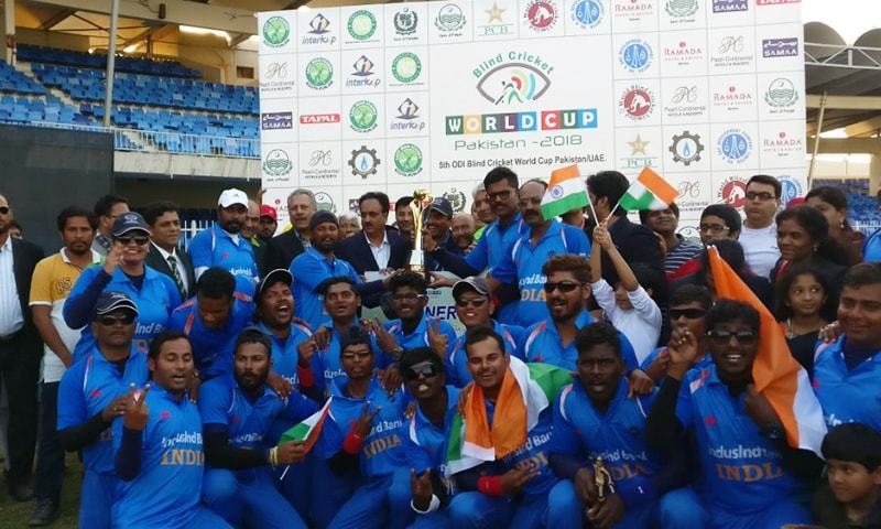 Indian blind cricket team poses for a photo after lifting the World Cup trophy.— BCCI Twitter