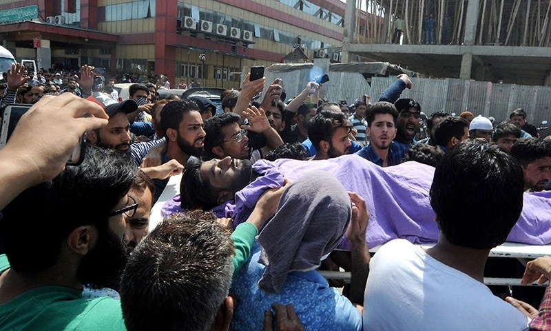 Kashmiri mourners carry the body of a civilian who was hit by an armoured vehicle — AFP