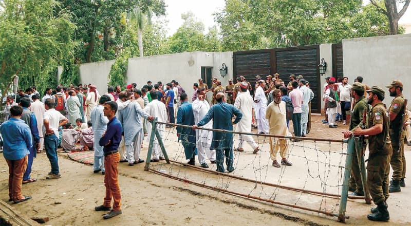 Residents of PP-144 gather outside the Zaman Park residence of PTI Chairman Imran Khan demanding election ticket for their candidate. —White Star