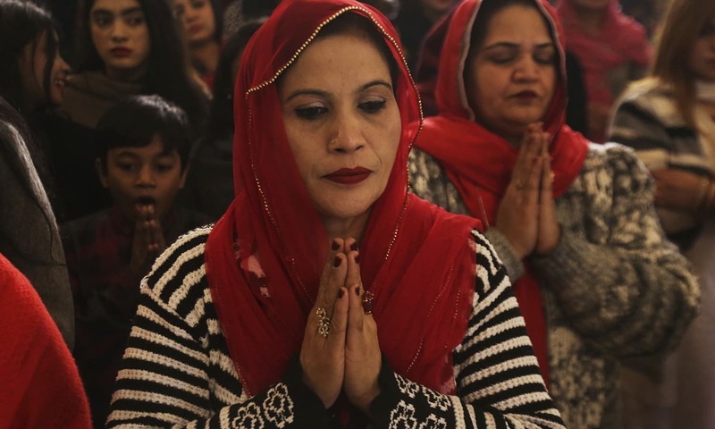 Christians attend midnight services at St. Anthony's Church to celebrate Christmas in Lahore, Pakistan, ─ AP
