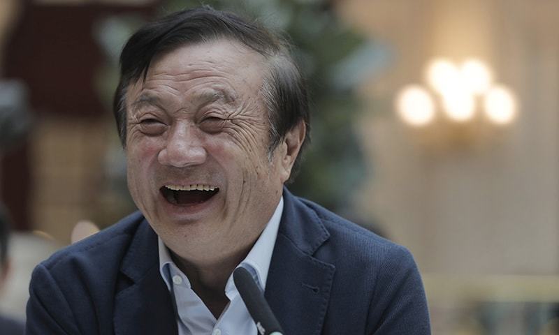 Ren Zhengfei, founder and CEO of Huawei, laughs during a round table meeting with the media in Shenzhen city, south China's Guangdong province, on Tuesday. — AP