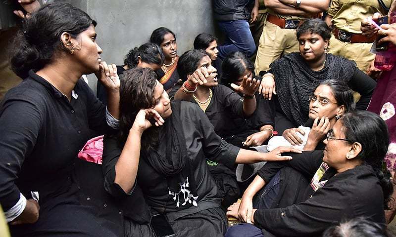 India women activists from a 'Manithi' NGO gesture as they had arrive to start their treck to Sabarimala Ayyappa temple.—AFP/File