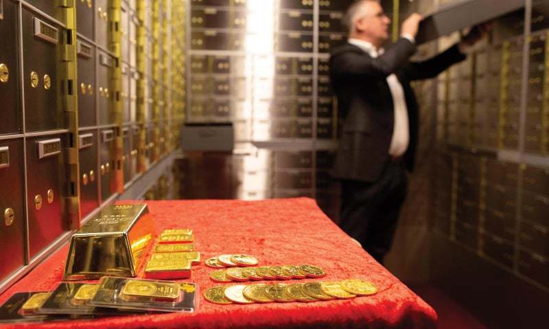 DUBLIN: Seamus Fahy, co-founder of Merrion vaults, removes a safety deposit box from a wall of boxes in Merrion vaults.