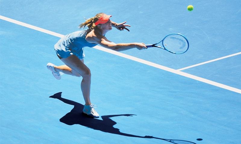 RUSSIA’S Maria Sharapova competes against Ashleigh Barty of Australia during their match.—AFP