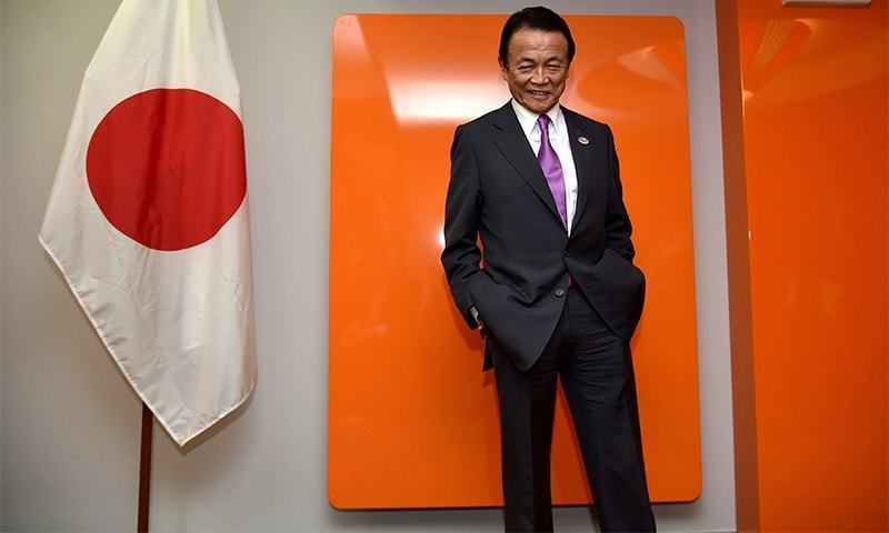 Japan finance minister Aso sorry for criticising childless Japan