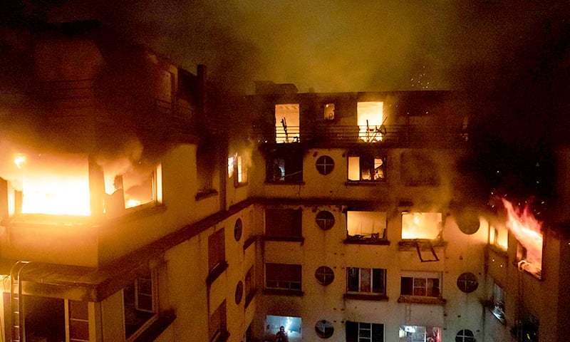 This handout picture taken and released by the Paris firefighters brigade (BSPP) on the night of February 5, 2019 shows the fire that started in a building in Erlanger street in the 16th arrondissement in Paris. — AFP