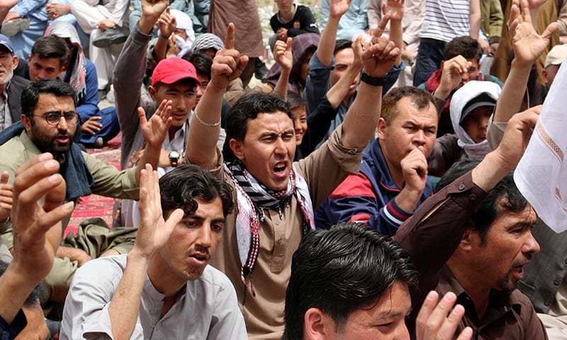 Family members and relatives chant slogans during a protest on April 13 to condemn the Hazarganji blast. ─ Reuters