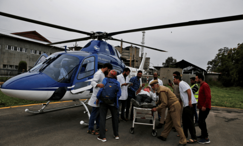 An injured person is rushed for treatment after he was evacuated in a helicopter following a cloudburst near the holy Amarnath cave shrine, at Sher-i-Kashmir Institute of Medical Sciences hospital in Srinagar, India-occupied Kashmir, on Saturday. — Reuters