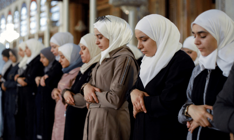 Women pray on the first day of Eidul Azha, at the Umayyad Mosque in Damascus, Syria on July 9. &mdash; Reuters