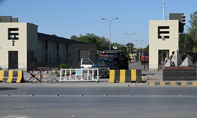 Policemen stand guard at the main entrance of the Pakistan’s army headquarters, a day after protests by PTI activists and supporters of former PM Imran Khan, in Rawalpindi on Wednesday.