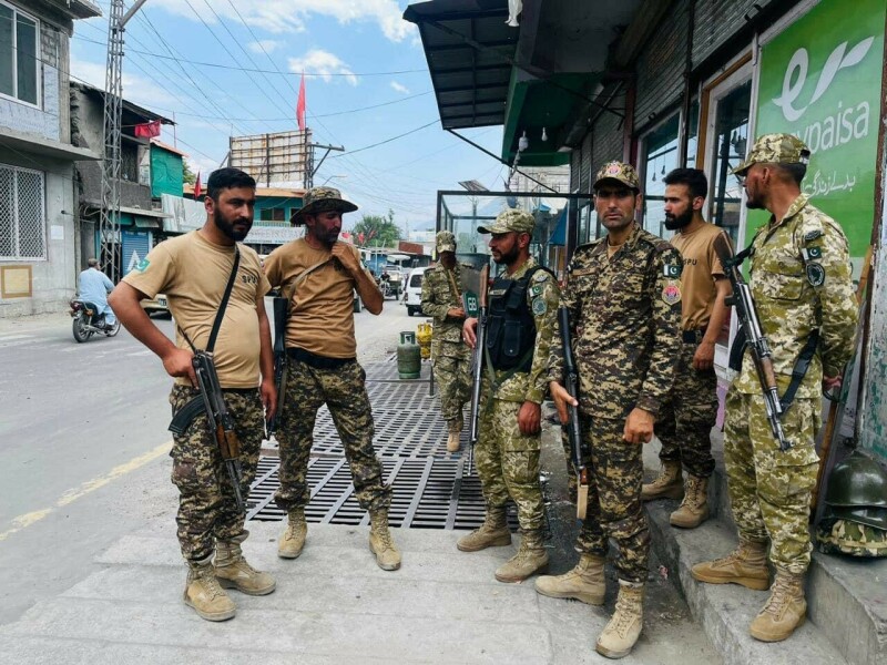  Security personnel stand on a roadside in Gilgit. —Twitter / pamirtimes 