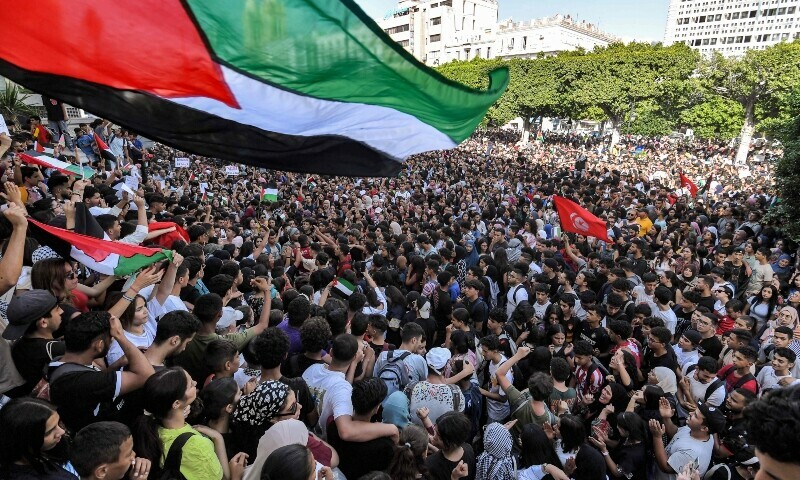 Protesters gather for an anti-Israel demonstration outside the French embassy headquarters along the Avenue Habib Bourguiba in the centre of Tunis. &mdash; AFP
