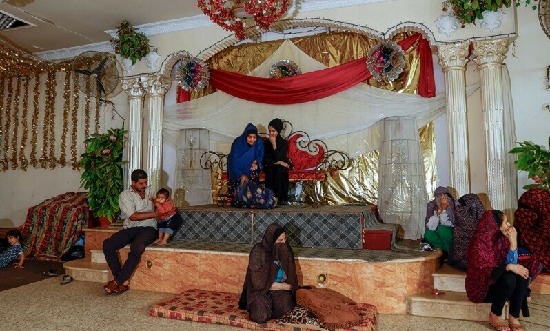 People rest as Palestinians, who fled their house amid Israeli strikes, shelter at a wedding hall after Israel&rsquo;s call for more than 1 million civilians in northern Gaza to move south, in Khan Younis in the southern Gaza Strip on October 19, 2023. &mdash; Reuters