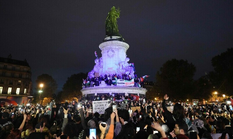 Protesters gather around the Monument a la Republique during a demonstration in support of Palestinians at Place de la Republique during in Paris. &mdash; AFP