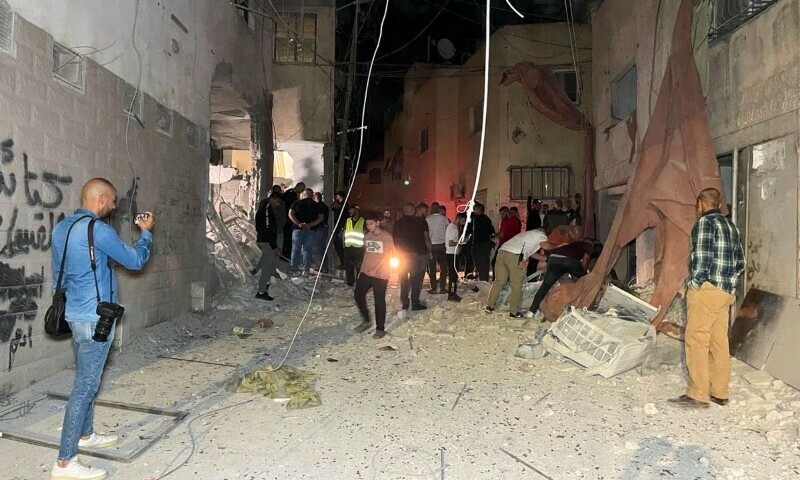 People inspect the damage after an Israeli strike hit a compound beneath a mosque that the Israeli military said was being used by militants to organize attacks, in Jenin refugee camp in the Israeli-occupied West Bank. &mdash; Reuters