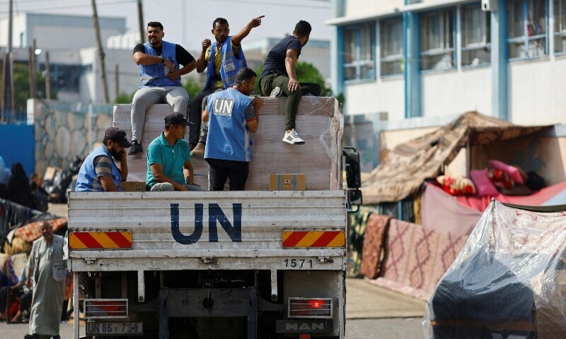 United Nations trucks distribute aid in Gaza Strip on Oct 23. — AFP