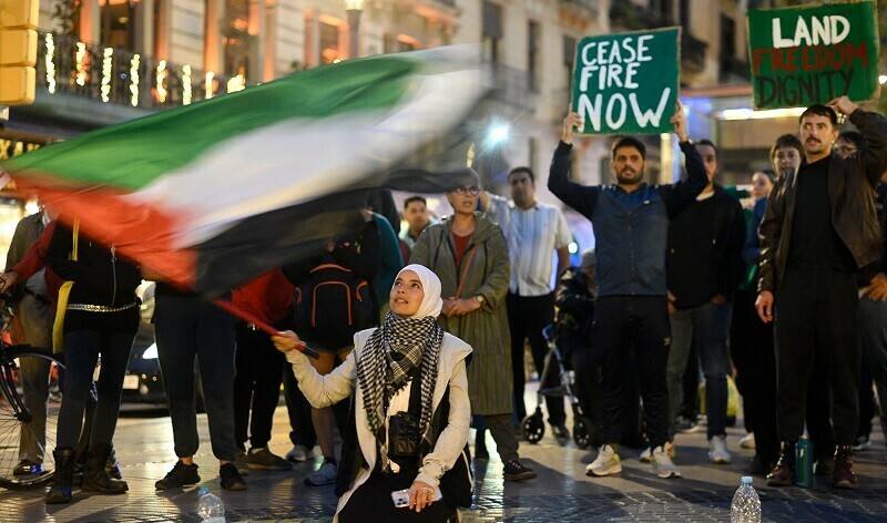 A protestor waves a Palestinian flag during a demonstration in support of Palestinians, in Barcelona on October 26, 2023. &mdash; AFP
