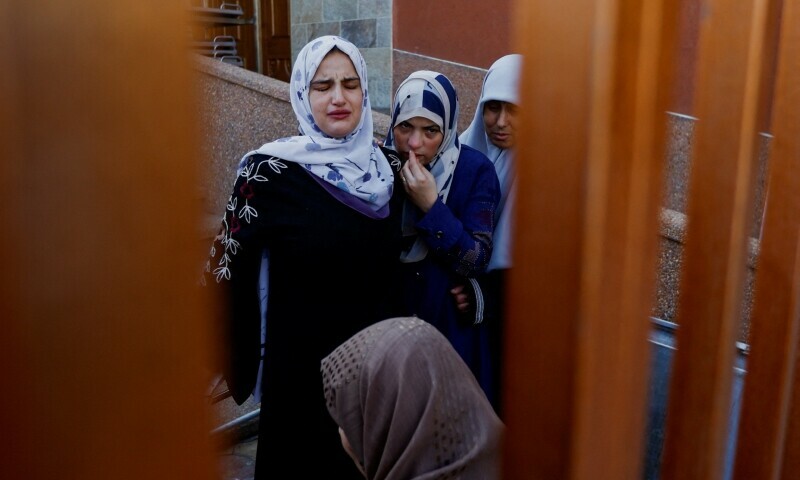 Mourners react near the bodies of Palestinians killed in Israeli strikes during their funeral, in Khan Younis in the southern Gaza Strip on October 31. &mdash; Reuters