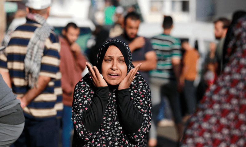  The relative of a victim killed a day earlier in an Israeli strike that hit the entrance of Al-Shifa hospital in Gaza City, reacts during a funeral held for the victims on November 4. &mdash; AFP 