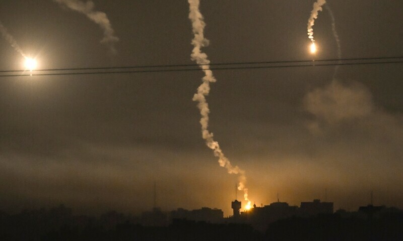 This picture taken from Sderot along the border with the Gaza Strip late on November 6, 2023, shows flares above northern Gaza during Israeli strikes. &mdash; AFP