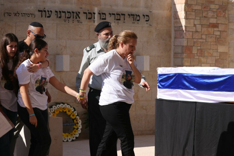 Mourners attend the funeral of kidnapped female soldier Noa Marciano, after her remains were recovered from Gaza, in the central city of Modiin on November 17. — AFP