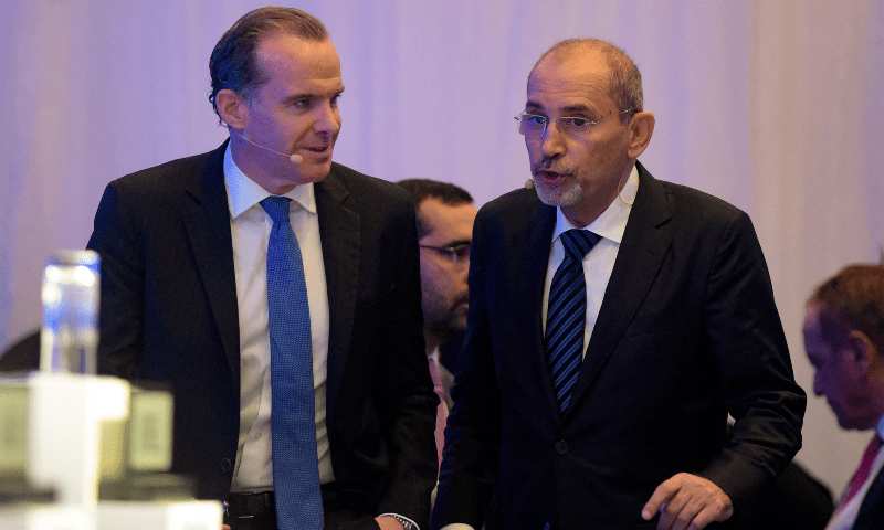  Jordanian Deputy PM and Foreign Minister Ayman Safadi (R) and US National Security Council Coordinator for the MENA Brett McGurk, engage in a conversation in Manama on Nov 18, 2023. &mdash; AFP 
